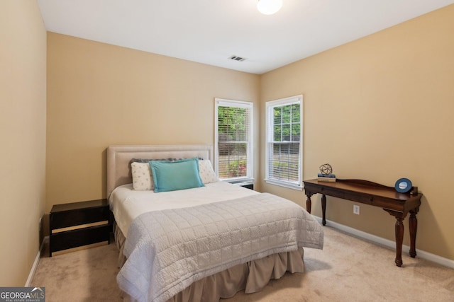 bedroom featuring carpet floors and baseboards