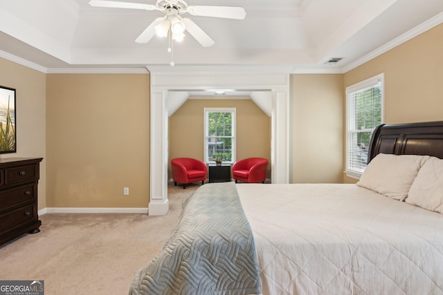 bedroom featuring a raised ceiling, light carpet, ornamental molding, baseboards, and a ceiling fan