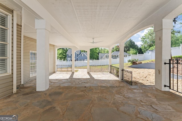view of patio / terrace with a fenced backyard and ceiling fan