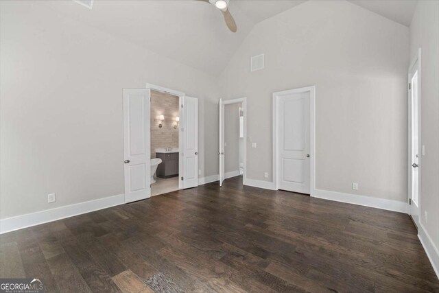 7285 Cordery Rd, Cumming, GA 30040 - unfurnished bedroom featuring visible vents, ensuite bathroom, baseboards, high vaulted ceiling, and dark wood finished floors
