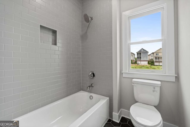 7285 Cordery Rd, Cumming, GA 30040 - bathroom with toilet, baseboards, and shower / bathing tub combination
