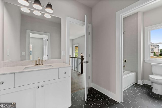7285 Cordery Rd, Cumming, GA 30040 - bathroom featuring tile patterned flooring, vanity, baseboards, toilet, and bathing tub / shower combination