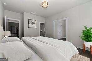 7285 Cordery Rd, Cumming, GA 30040 - bedroom featuring baseboards and dark wood-style floors