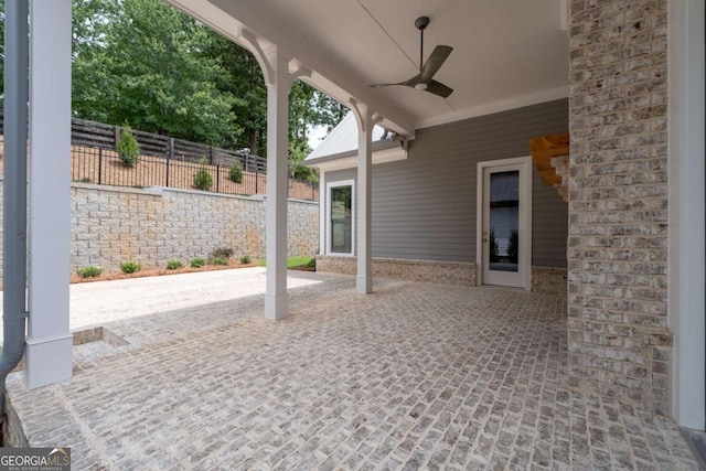 7285 Cordery Rd, Cumming, GA 30040 - view of patio featuring ceiling fan and fence