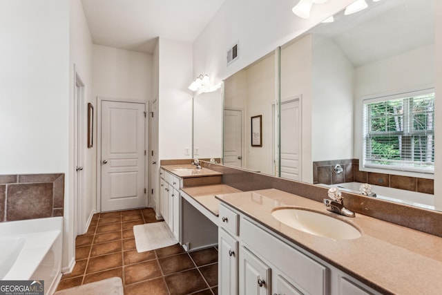 301 Downing Creek Trl, Canton, GA 30114 - bathroom with a garden tub, double vanity, tile patterned flooring, and high vaulted ceiling