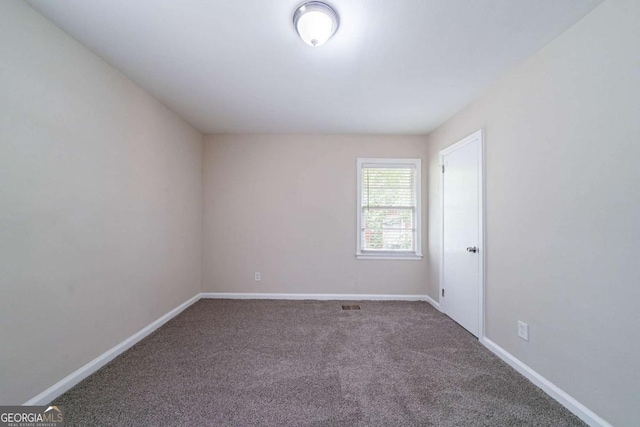 1774 Austin Dr, Decatur, GA 30032 - spare room featuring carpet floors, baseboards, and visible vents