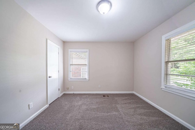 1774 Austin Dr, Decatur, GA 30032 - carpeted spare room with baseboards and plenty of natural light