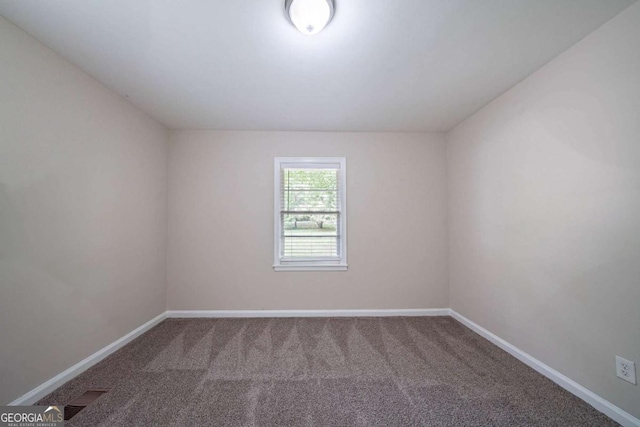 1774 Austin Dr, Decatur, GA 30032 - spare room featuring carpet floors and baseboards