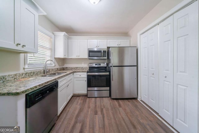 1774 Austin Dr, Decatur, GA 30032 - kitchen featuring a sink, appliances with stainless steel finishes, and white cabinetry