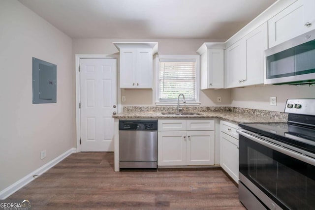 1774 Austin Dr, Decatur, GA 30032 - kitchen featuring a sink, electric panel, stainless steel appliances, and white cabinetry