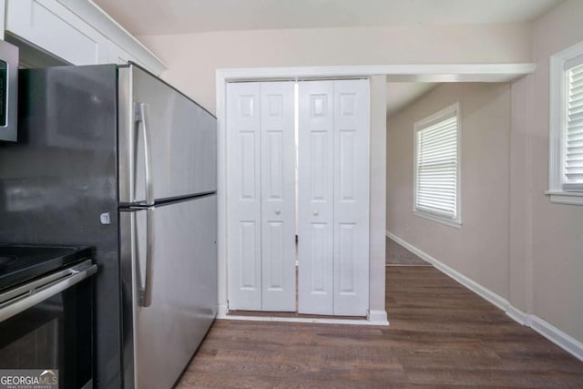 1774 Austin Dr, Decatur, GA 30032 - kitchen featuring white cabinets, dark wood-style flooring, baseboards, and appliances with stainless steel finishes
