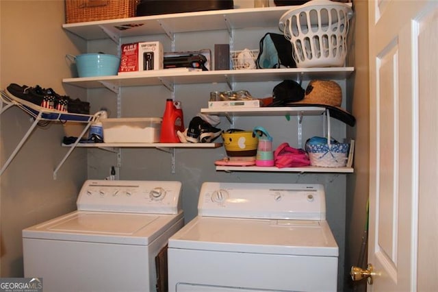 clothes washing area featuring laundry area and washing machine and dryer