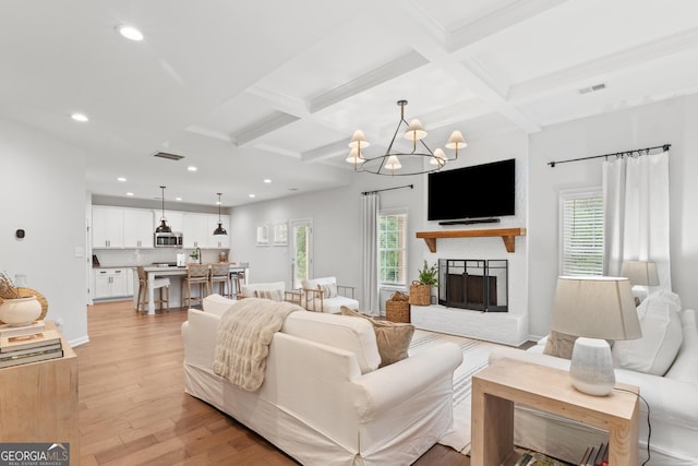 152 Creekrise Pl, Palmetto, GA 30268 - living area featuring coffered ceiling, beam ceiling, light wood-style floors, recessed lighting, and a chandelier