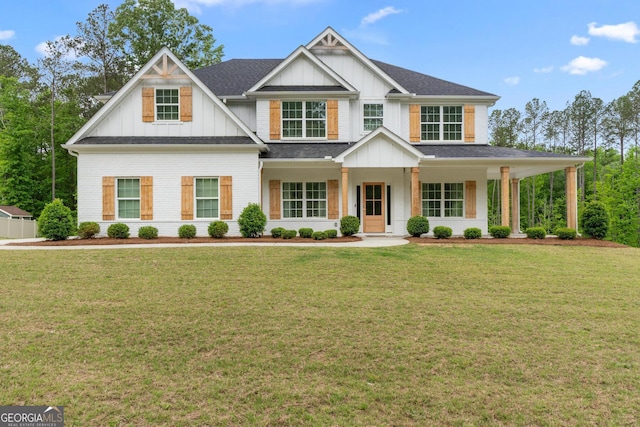 152 Creekrise Pl, Palmetto, GA 30268 - view of front of property featuring board and batten siding, a front yard, a porch, and roof with shingles