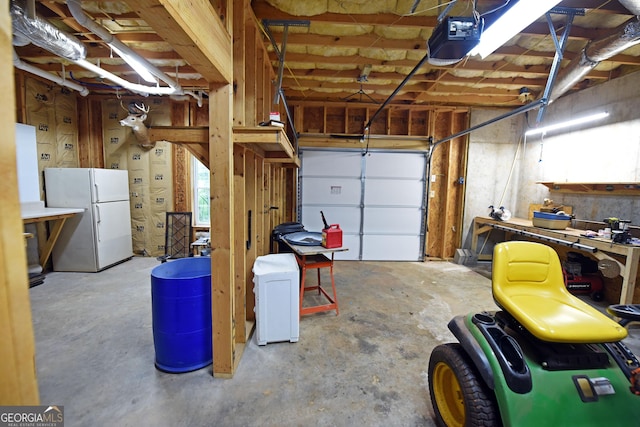 garage with a garage door opener and freestanding refrigerator