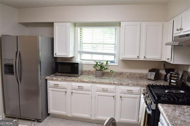 kitchen featuring white cabinetry, appliances with stainless steel finishes, under cabinet range hood, and light tile patterned floors