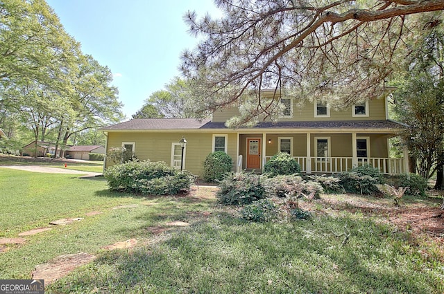 view of front of property featuring a porch and a front yard