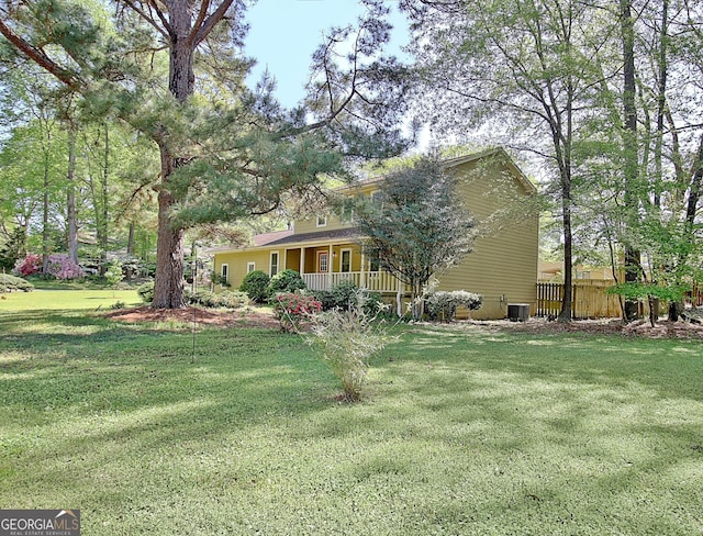 exterior space featuring fence and covered porch