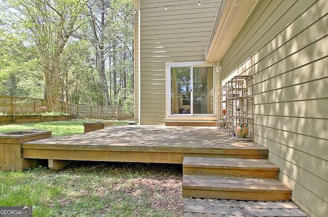 deck featuring a fenced backyard