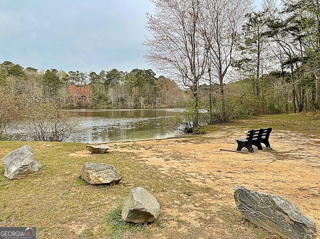 view of water feature with a view of trees
