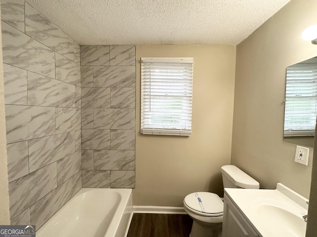 full bathroom with plenty of natural light, a textured ceiling, and wood finished floors