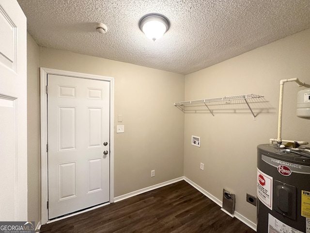 laundry room with laundry area, dark wood-style flooring, a textured ceiling, hookup for a washing machine, and water heater
