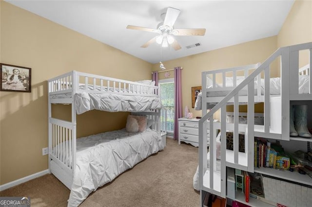 carpeted bedroom with baseboards and visible vents