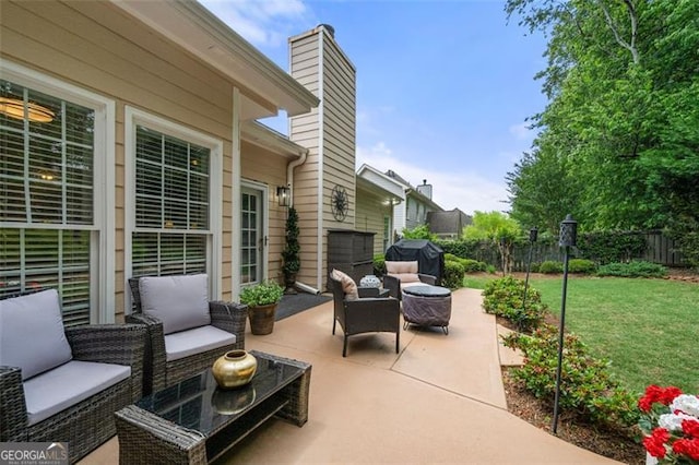 view of patio / terrace featuring fence and an outdoor hangout area