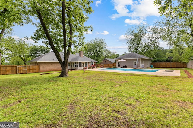 view of yard with a fenced backyard, a fenced in pool, and a patio area