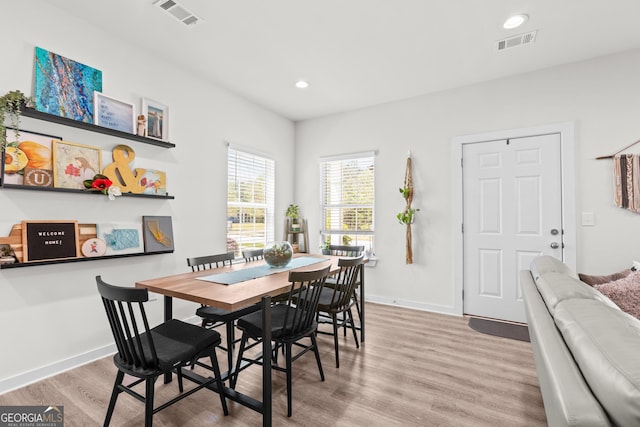 dining room featuring visible vents, recessed lighting, baseboards, and wood finished floors
