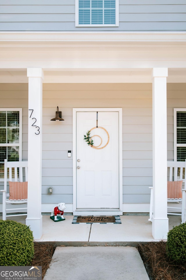 entrance to property with a porch