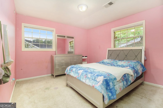 1239 Sharonton Dr, Stone Mountain, GA 30083 - bedroom featuring multiple windows, baseboards, and carpet