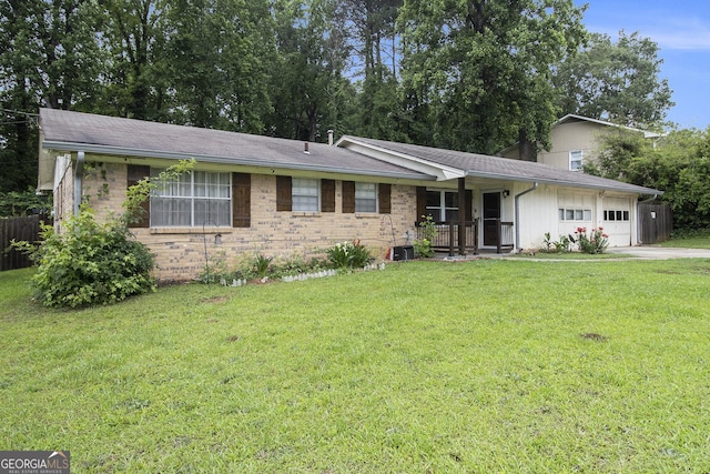 1239 Sharonton Dr, Stone Mountain, GA 30083 - ranch-style house featuring a garage, brick siding, concrete driveway, covered porch, and central AC unit