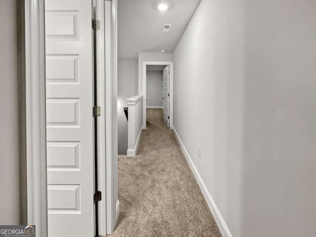 5291 Tuscany Dr, Douglasville, GA 30135 - hallway featuring baseboards, visible vents, and light carpet