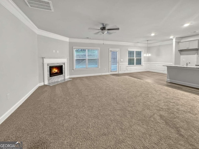5291 Tuscany Dr, Douglasville, GA 30135 - unfurnished living room with carpet flooring, a ceiling fan, visible vents, and ornamental molding