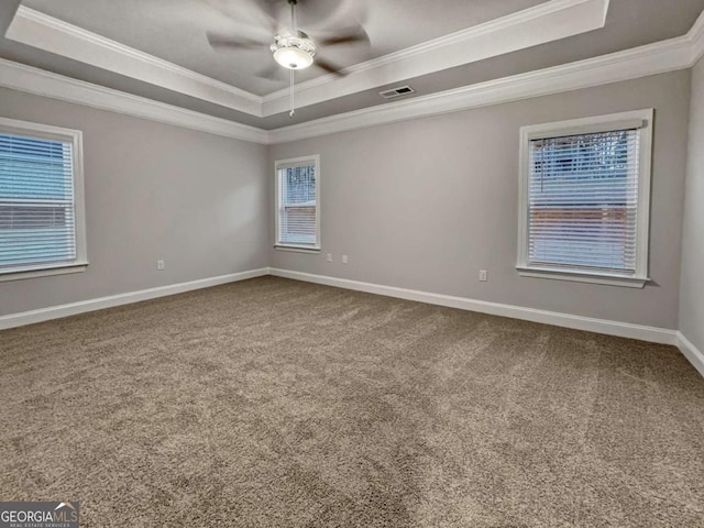 5291 Tuscany Dr, Douglasville, GA 30135 - spare room featuring carpet flooring, visible vents, ornamental molding, and a raised ceiling
