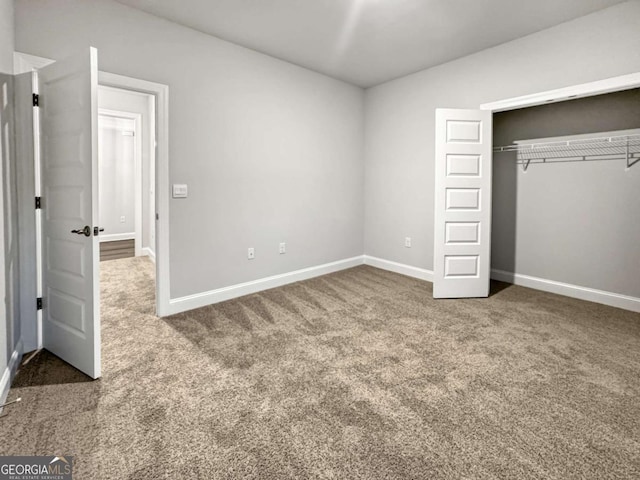 5291 Tuscany Dr, Douglasville, GA 30135 - unfurnished bedroom with baseboards, carpet, and a closet