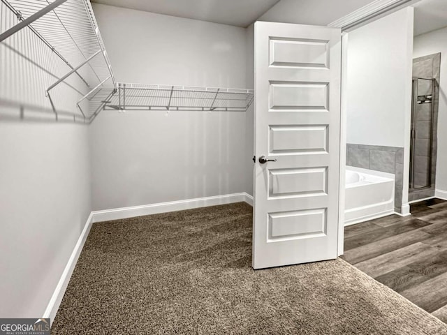5291 Tuscany Dr, Douglasville, GA 30135 - spacious closet featuring wood finished floors