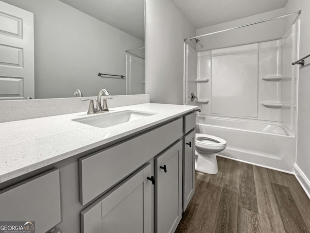 5291 Tuscany Dr, Douglasville, GA 30135 - bathroom featuring vanity, toilet, wood finished floors, and  shower combination
