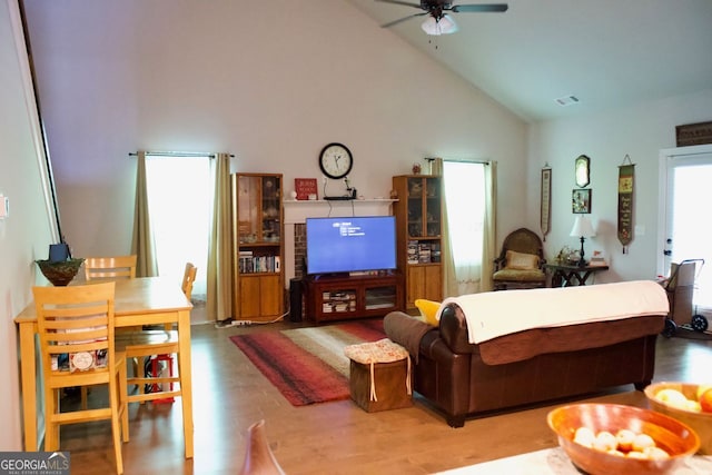 584 Amaranth Trl, Hoschton, GA 30548 - living area featuring ceiling fan, wood finished floors, and high vaulted ceiling