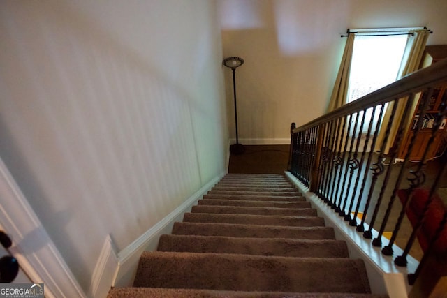 584 Amaranth Trl, Hoschton, GA 30548 - staircase featuring baseboards