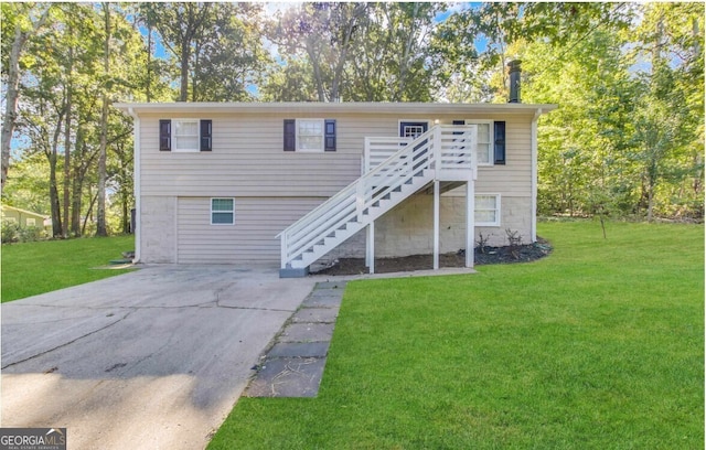 bi-level home featuring a front yard, stairway, and a deck
