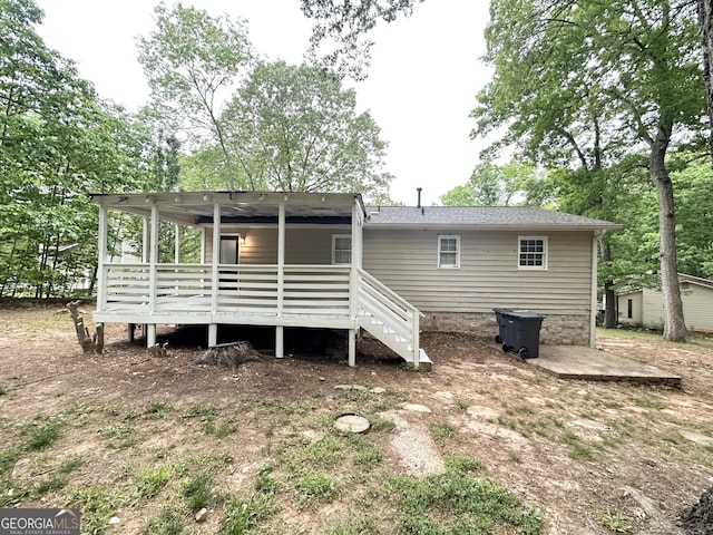 back of property with a patio and a deck