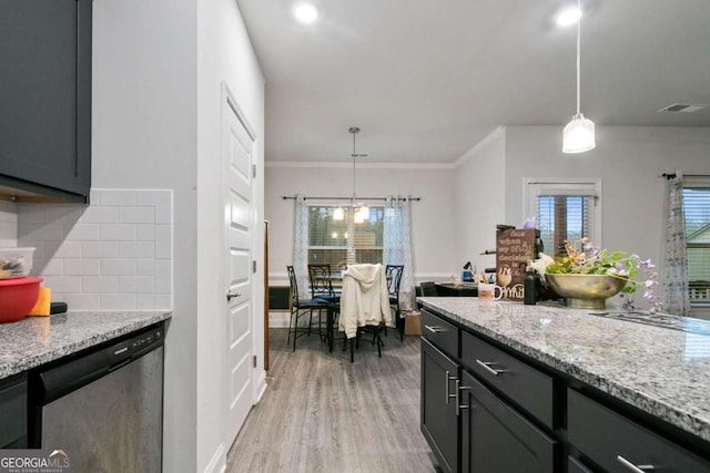 kitchen featuring visible vents, tasteful backsplash, light stone counters, light wood finished floors, and dishwasher