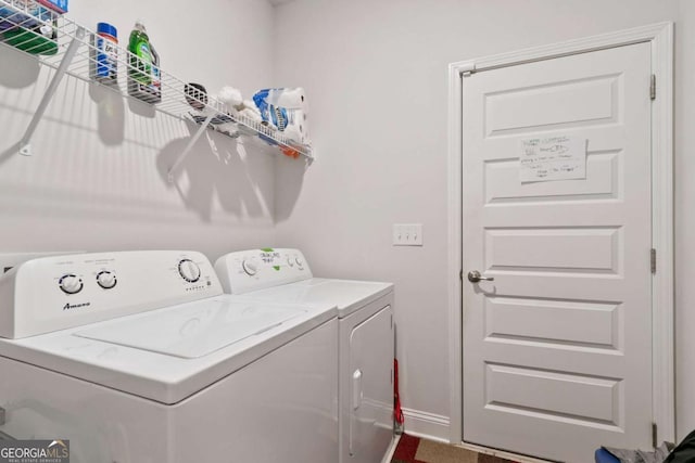laundry room featuring baseboards, laundry area, and washing machine and dryer