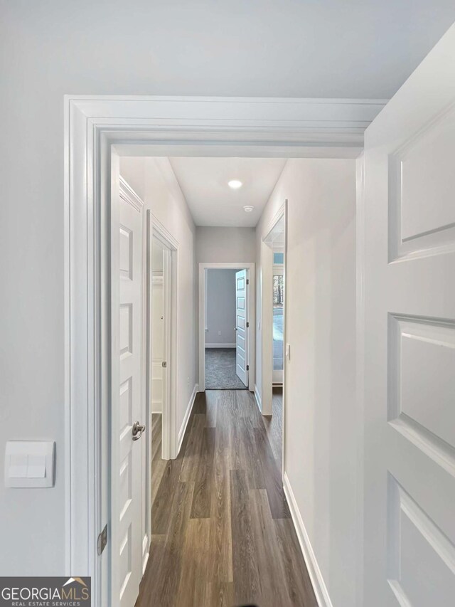 5331 Tuscany Dr, Douglasville, GA 30135 - hall with baseboards and dark wood-style flooring