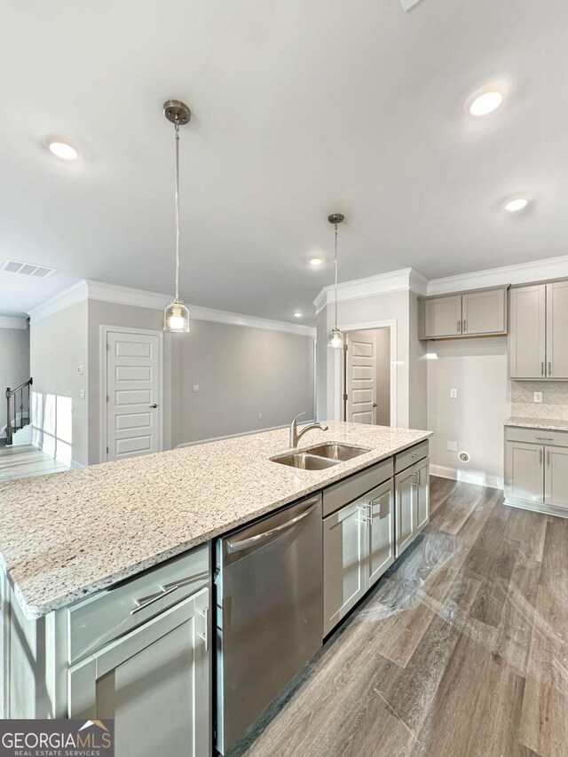 5331 Tuscany Dr, Douglasville, GA 30135 - kitchen with dishwasher, a sink, light stone counters, dark wood-style floors, and ornamental molding