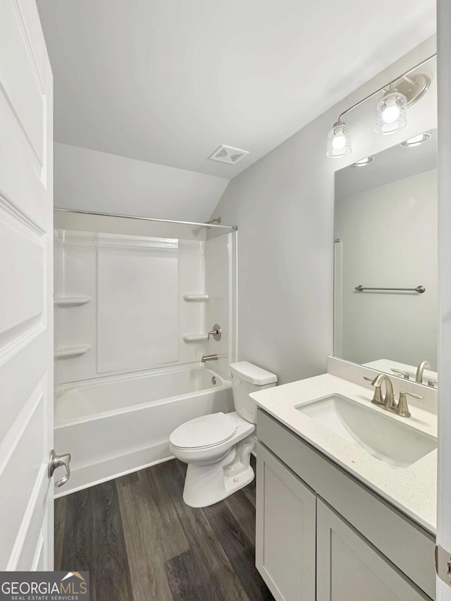 5331 Tuscany Dr, Douglasville, GA 30135 - full bathroom with shower / bath combination, visible vents, wood finished floors, vanity, and toilet