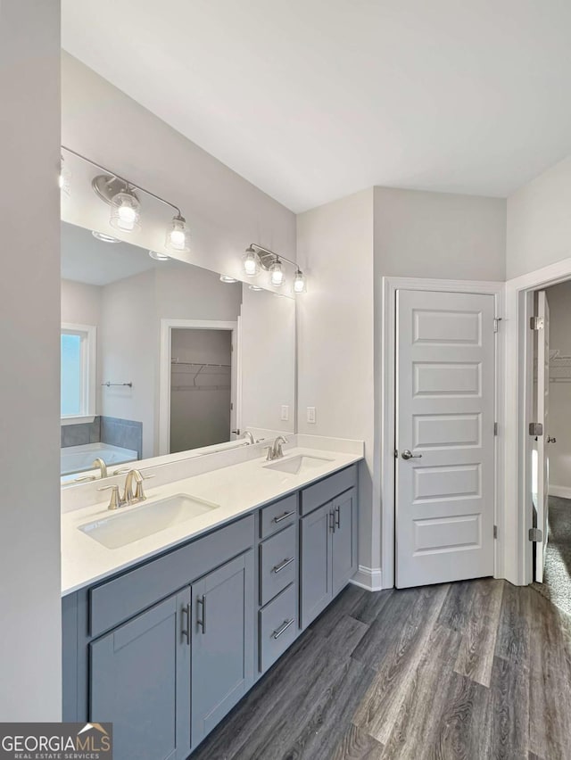 5331 Tuscany Dr, Douglasville, GA 30135 - full bathroom featuring double vanity, a spacious closet, and a sink