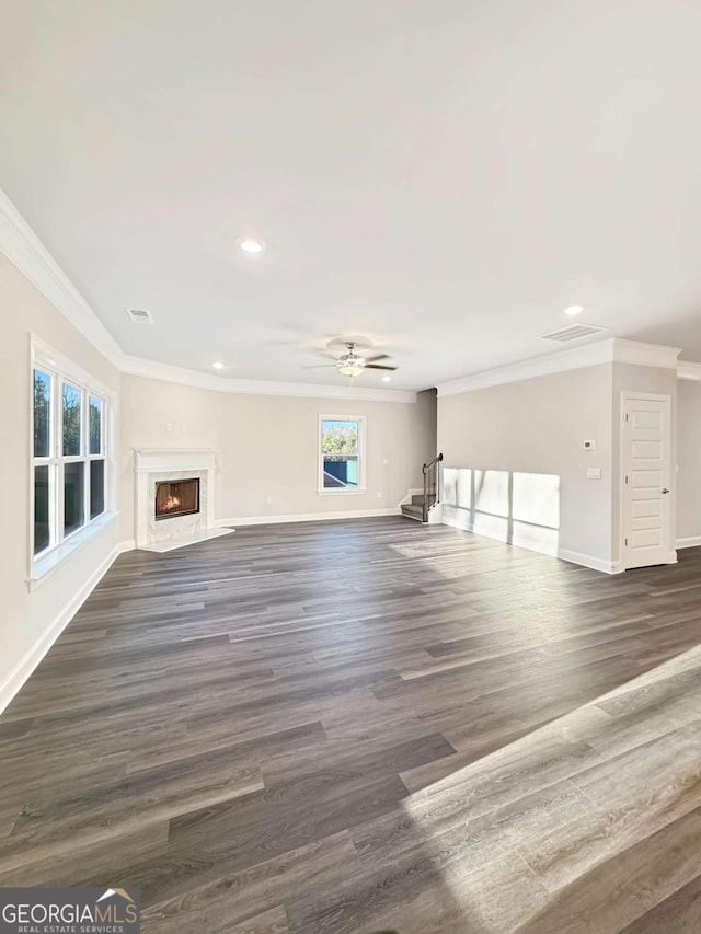 5331 Tuscany Dr, Douglasville, GA 30135 - unfurnished living room featuring crown molding, a premium fireplace, baseboards, and stairway